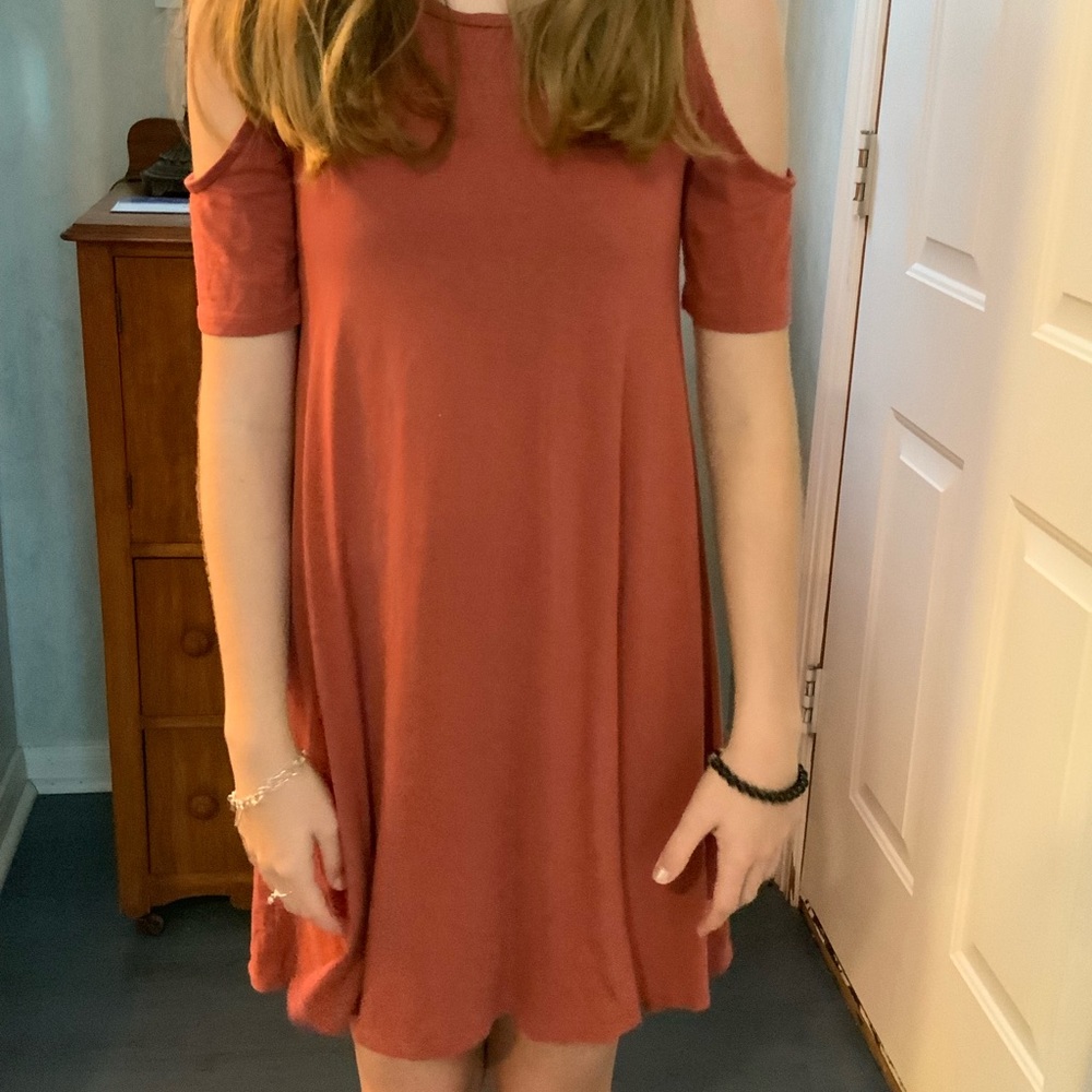 Orangy dress with shoulder holes